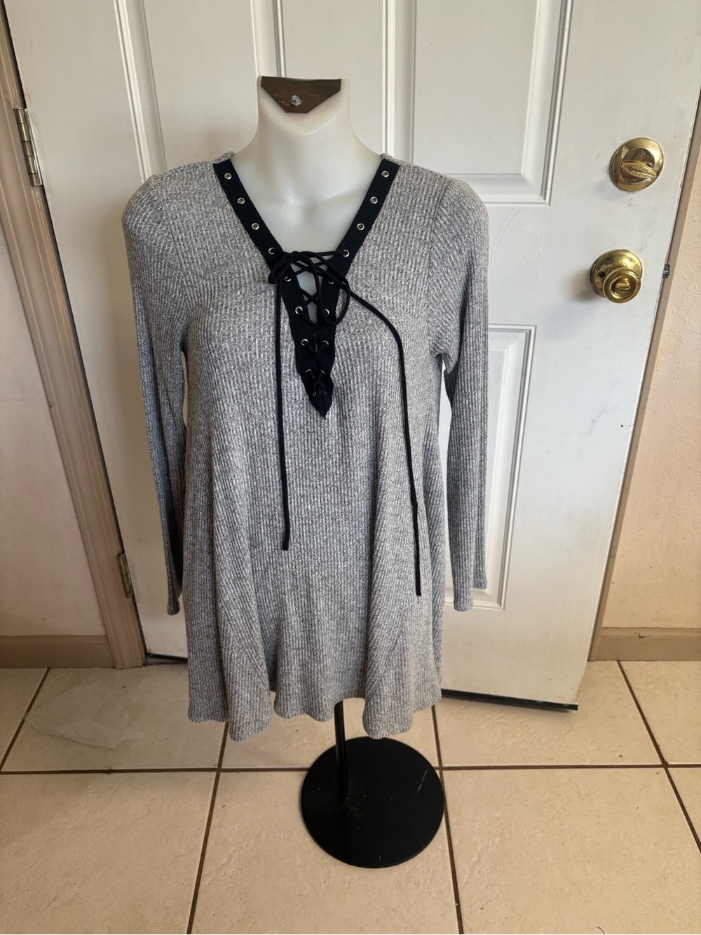 Small Nu Label gray black lace-up front/grommet long-sleeve lace-up tunic top.